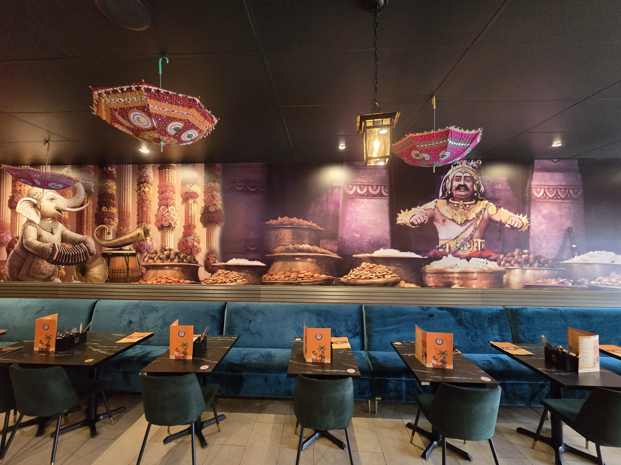 Antera Function Centre — banquet seating with mural wall